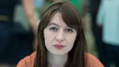 Sally Rooney states she will not enter the UK over arrest fears